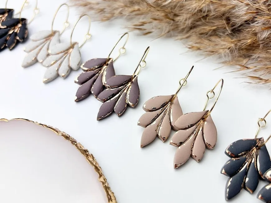 Leaf-shaped clay dangle earrings in cream, taupe, plum and navy